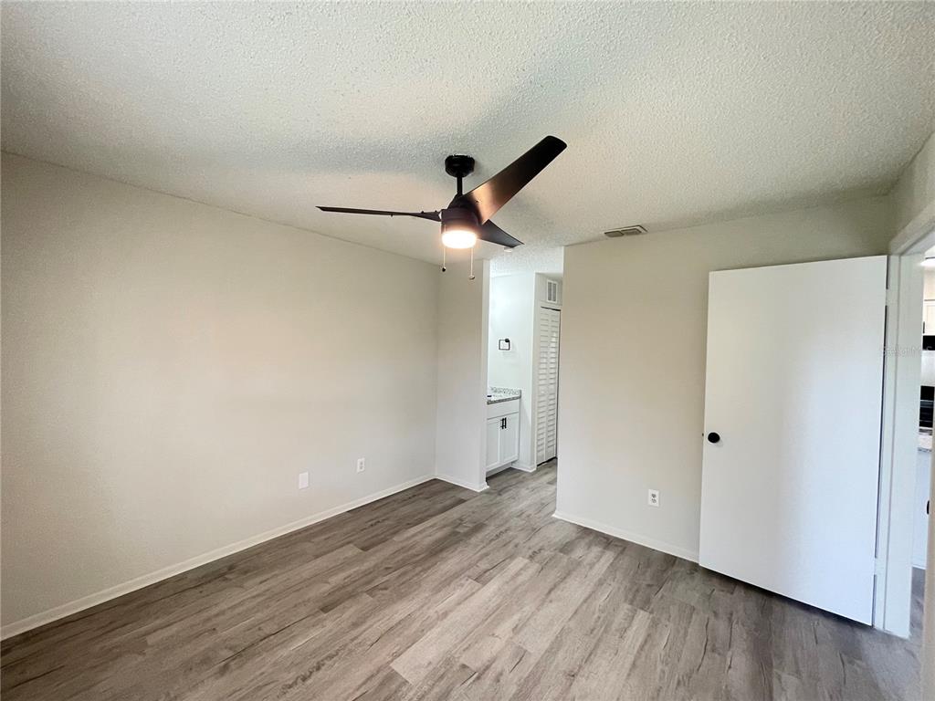 241 Afton Square, Unit 203 Altamonte Springs, FL 32714 - Photo 23 of 43 a view of empty room with wooden floor
