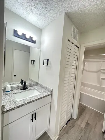 a bathroom with a toilet and a bathtub