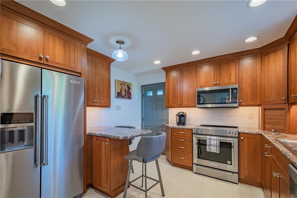 1311 Richard Road North Huntingdon, PA 15642 - Photo 5 of 21 Beautiful cherry kitchen with stainless steel appliances