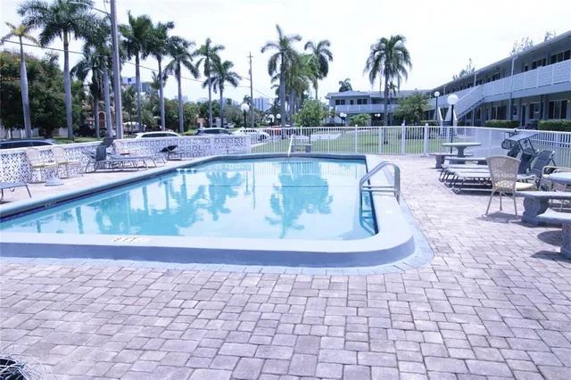 a view of a swimming pool with a patio