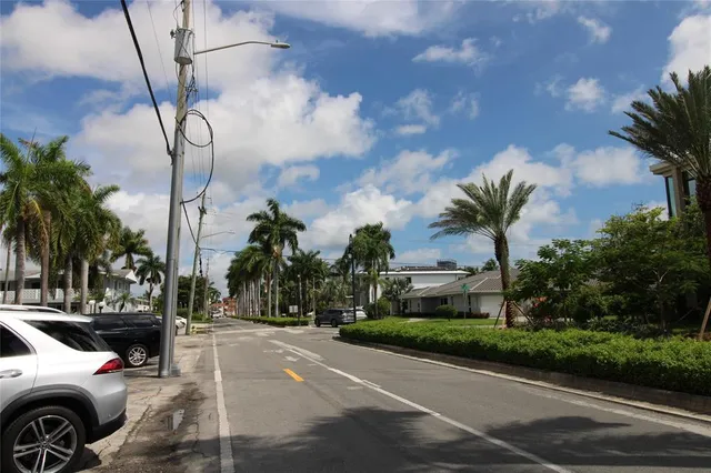 a view of a city street with cars