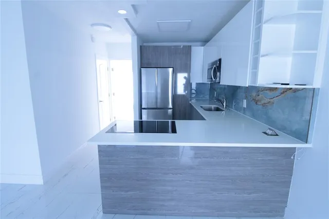 a view of a kitchen with a sink