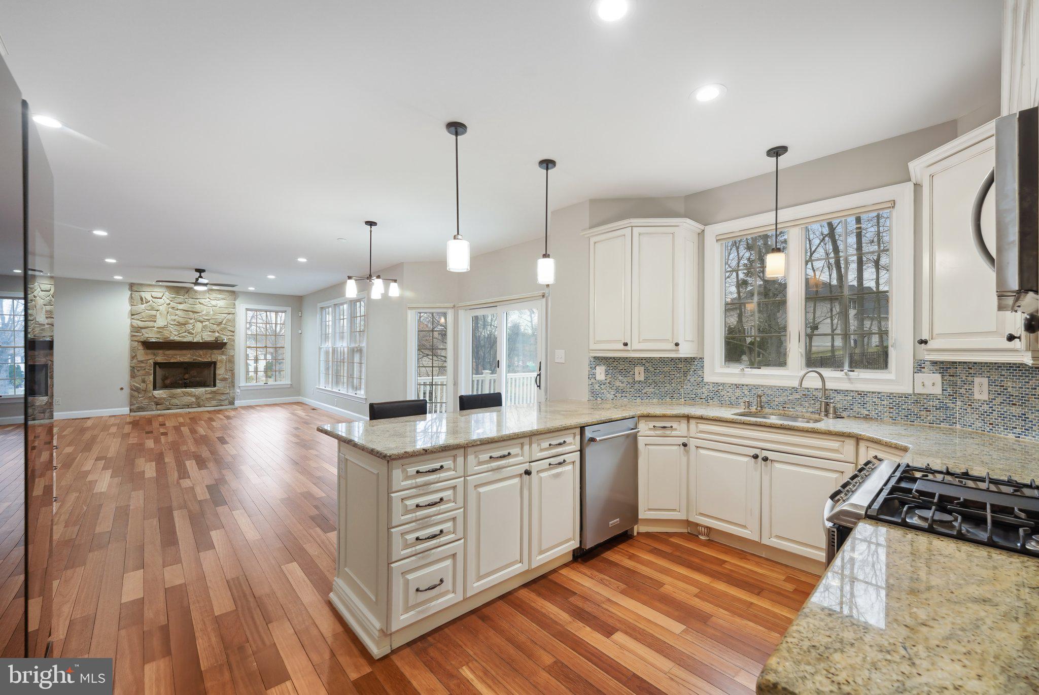 207 Summit Road Mount Laurel, NJ 08054 - Photo 15 of 57 a large kitchen with stainless steel appliances granite countertop a stove a sink and a refrigerator