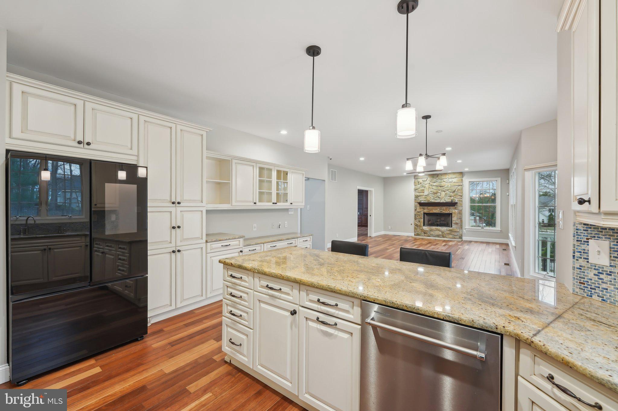 207 Summit Road Mount Laurel, NJ 08054 - Photo 17 of 57 a kitchen with stainless steel appliances granite countertop a sink a refrigerator a stove and white cabinets with wooden floor