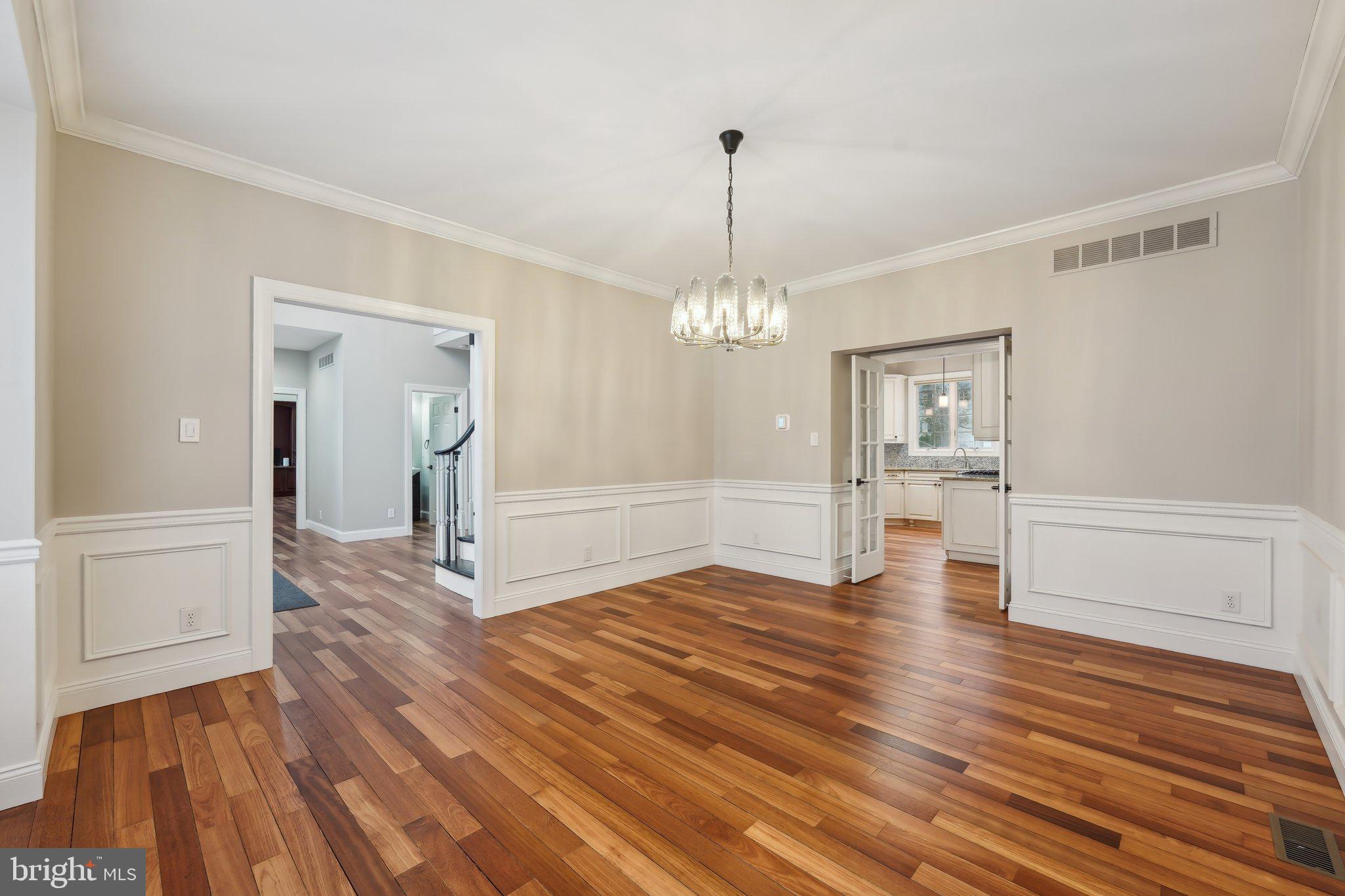 207 Summit Road Mount Laurel, NJ 08054 - Photo 18 of 57 a view of a room with wooden floor staircase and a kitchen