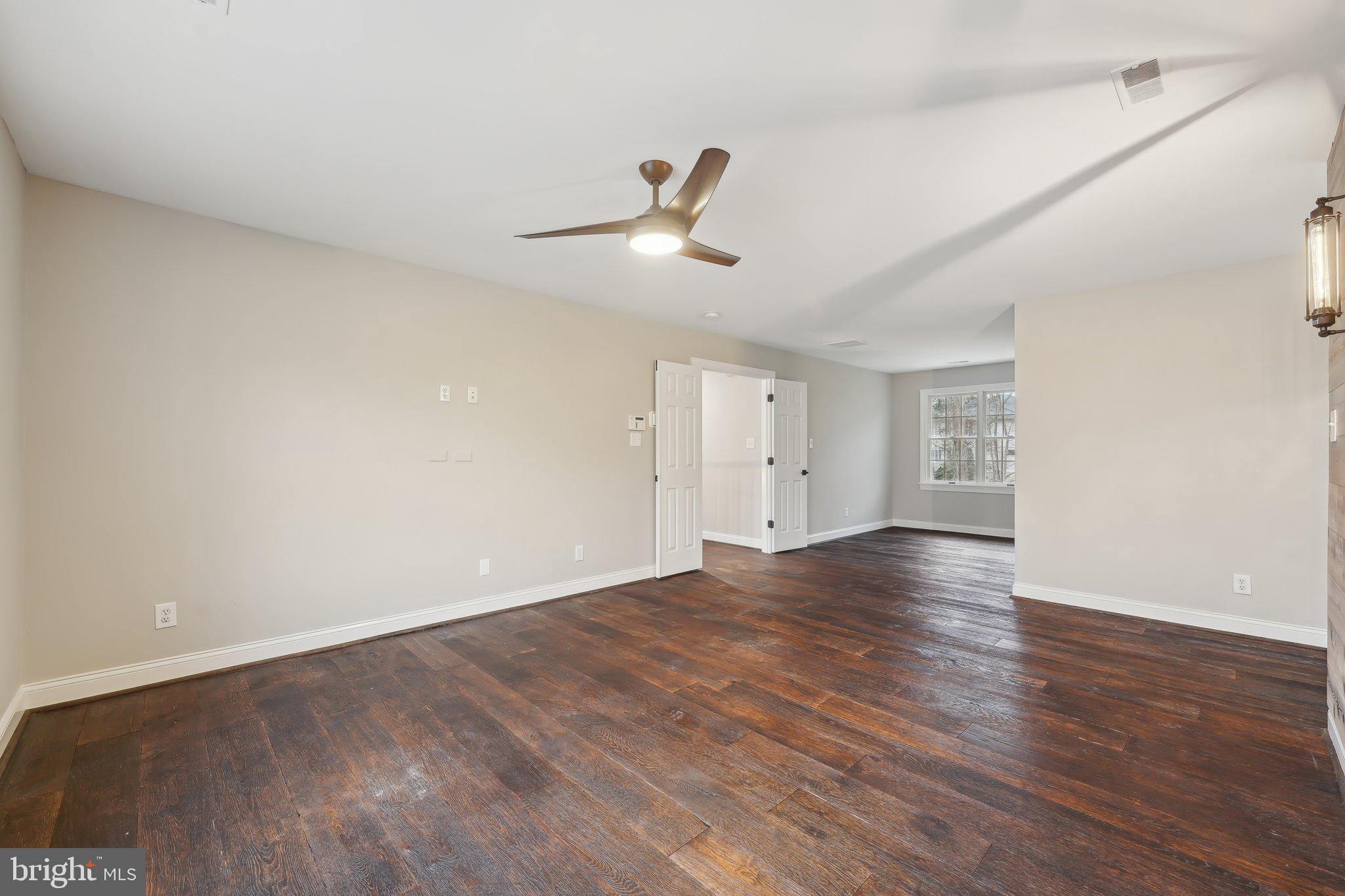 207 Summit Road Mount Laurel, NJ 08054 - Photo 27 of 57 a view of empty room with wooden floor and ceiling fan