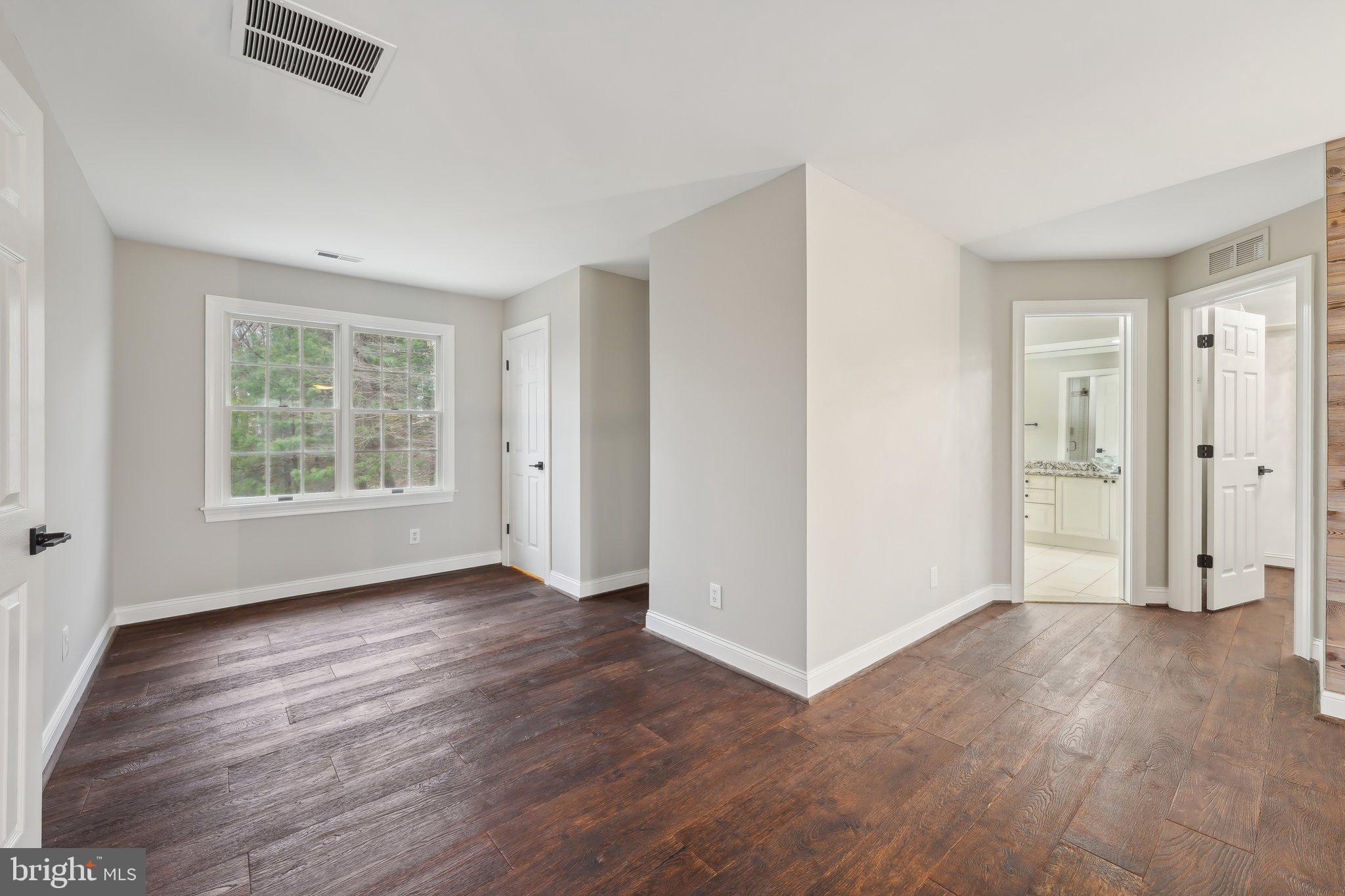 207 Summit Road Mount Laurel, NJ 08054 - Photo 28 of 57 an empty room with wooden floor cabinet and windows