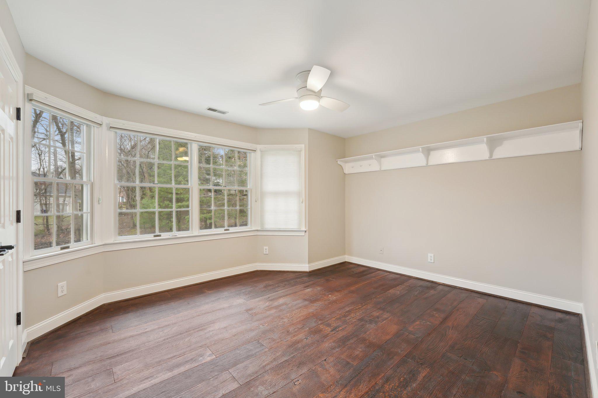 207 Summit Road Mount Laurel, NJ 08054 - Photo 32 of 57 a view of an empty room with wooden floor and a window