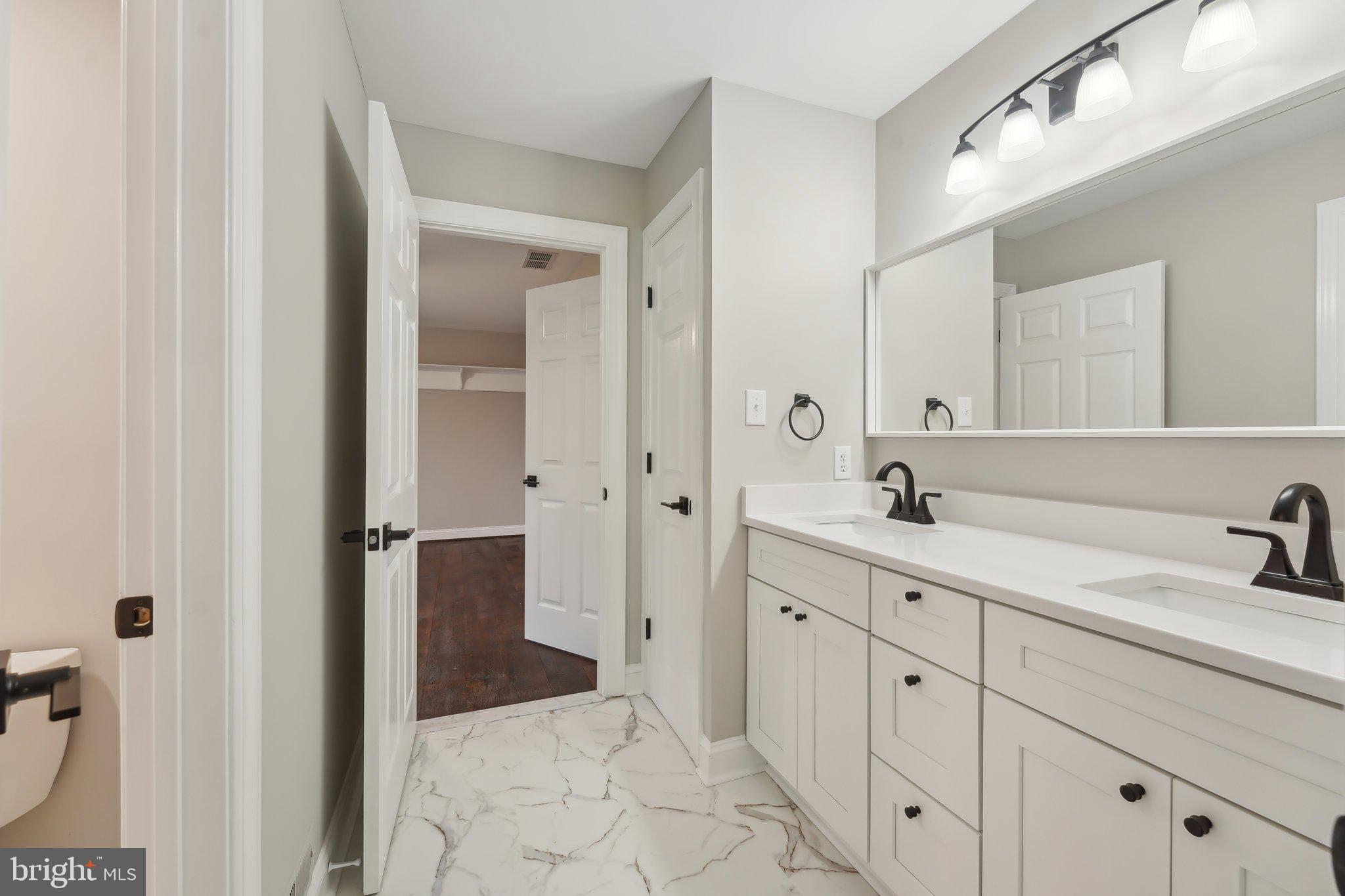 207 Summit Road Mount Laurel, NJ 08054 - Photo 34 of 57 a bathroom with a sink and a mirror with bathtub