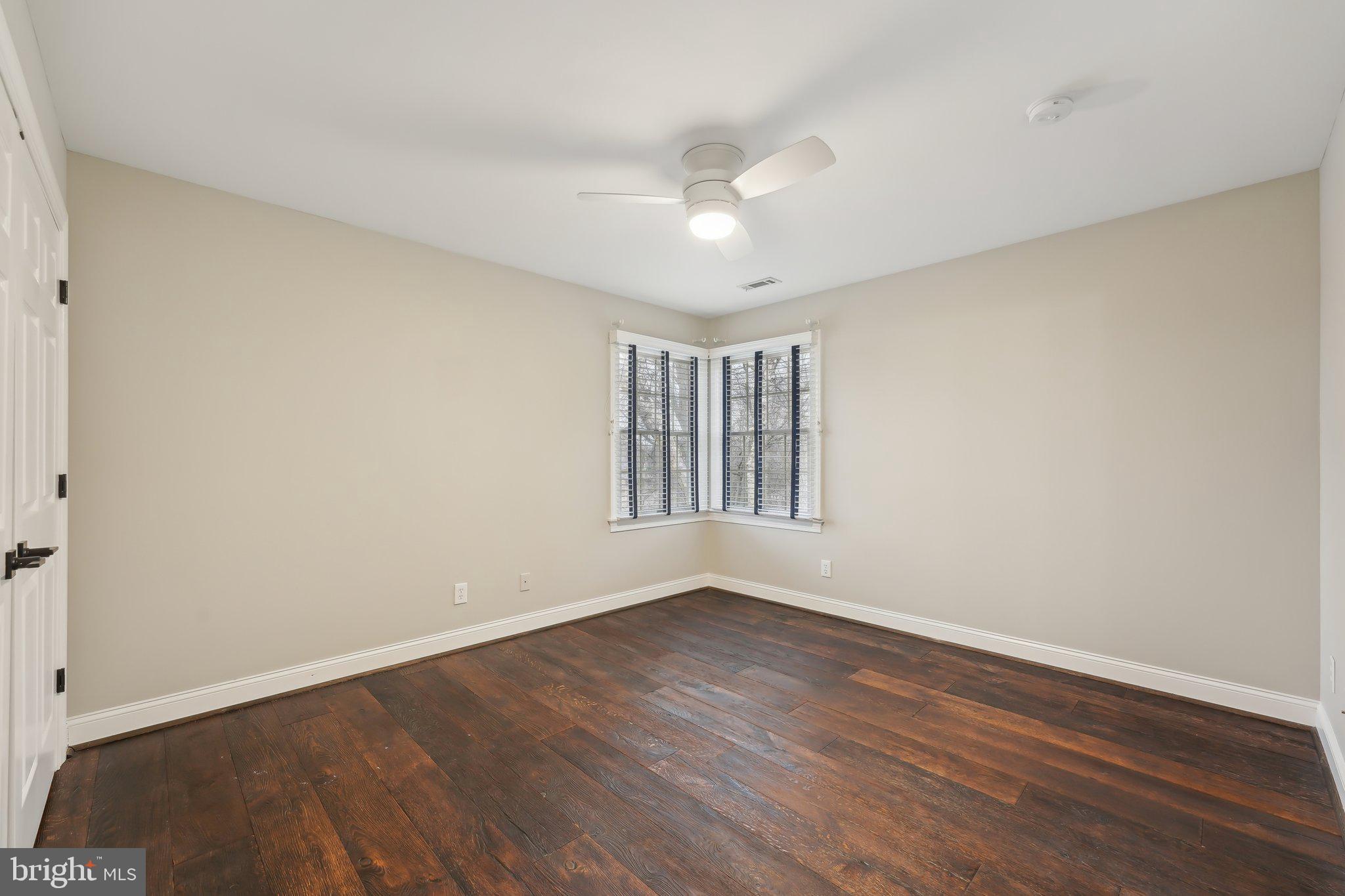 207 Summit Road Mount Laurel, NJ 08054 - Photo 36 of 57 a view of an empty room with wooden floor and a window