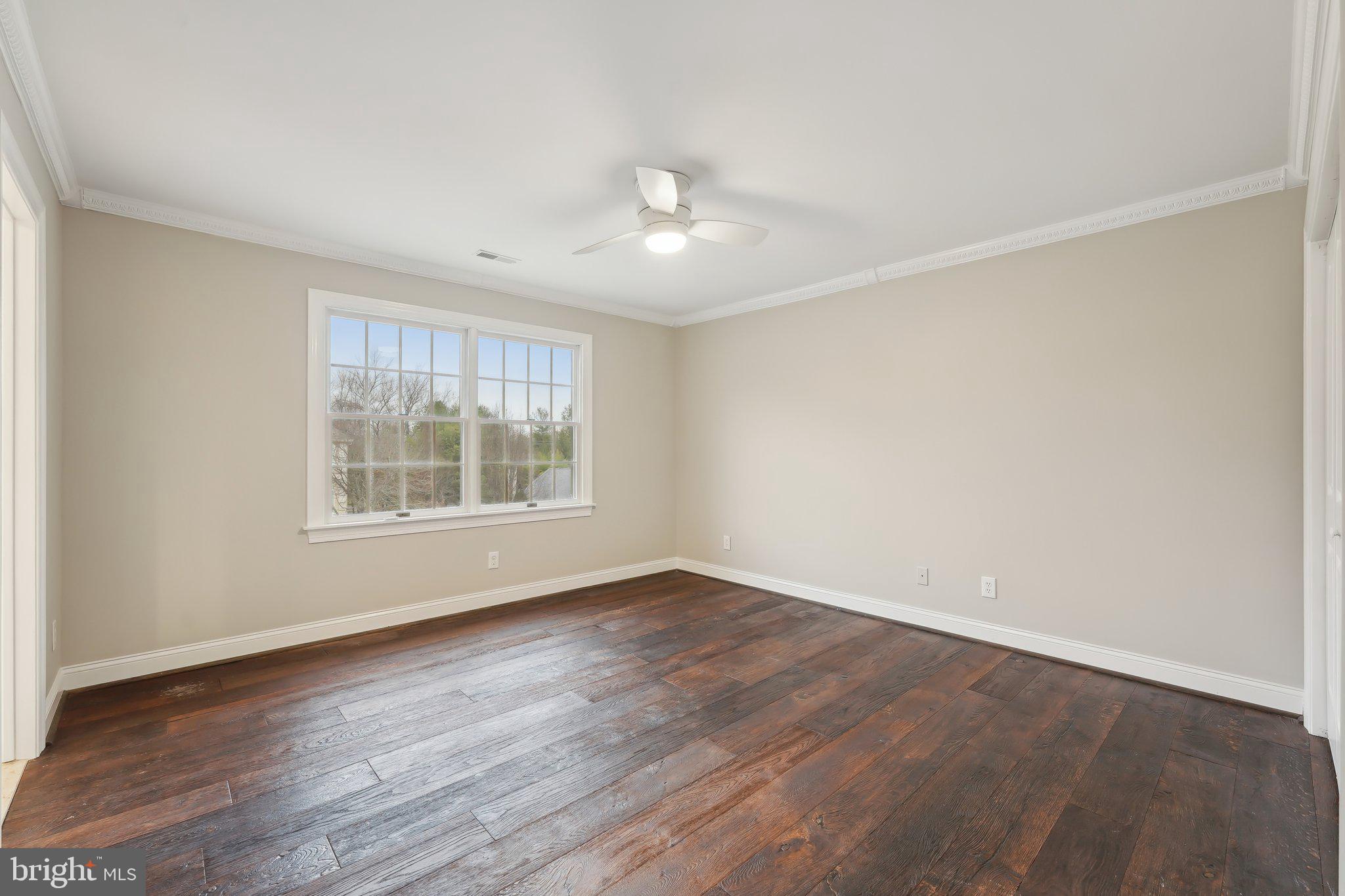 207 Summit Road Mount Laurel, NJ 08054 - Photo 38 of 57 an empty room with wooden floor and windows