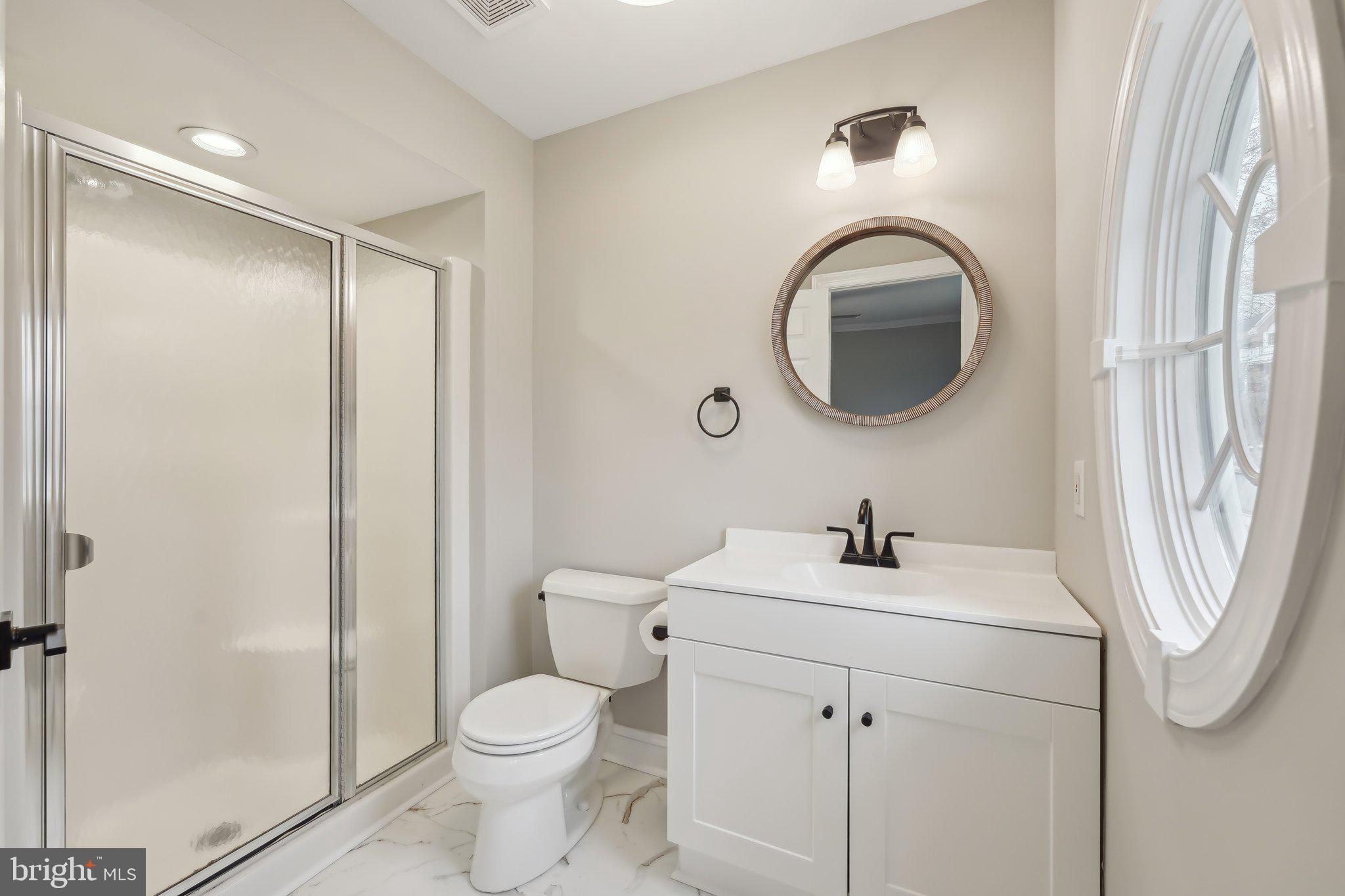 207 Summit Road Mount Laurel, NJ 08054 - Photo 40 of 57 a bathroom with a sink a toilet and a mirror
