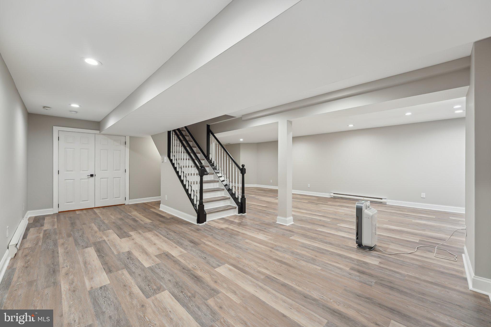 207 Summit Road Mount Laurel, NJ 08054 - Photo 42 of 57 a view of an empty room with wooden floor and stairs
