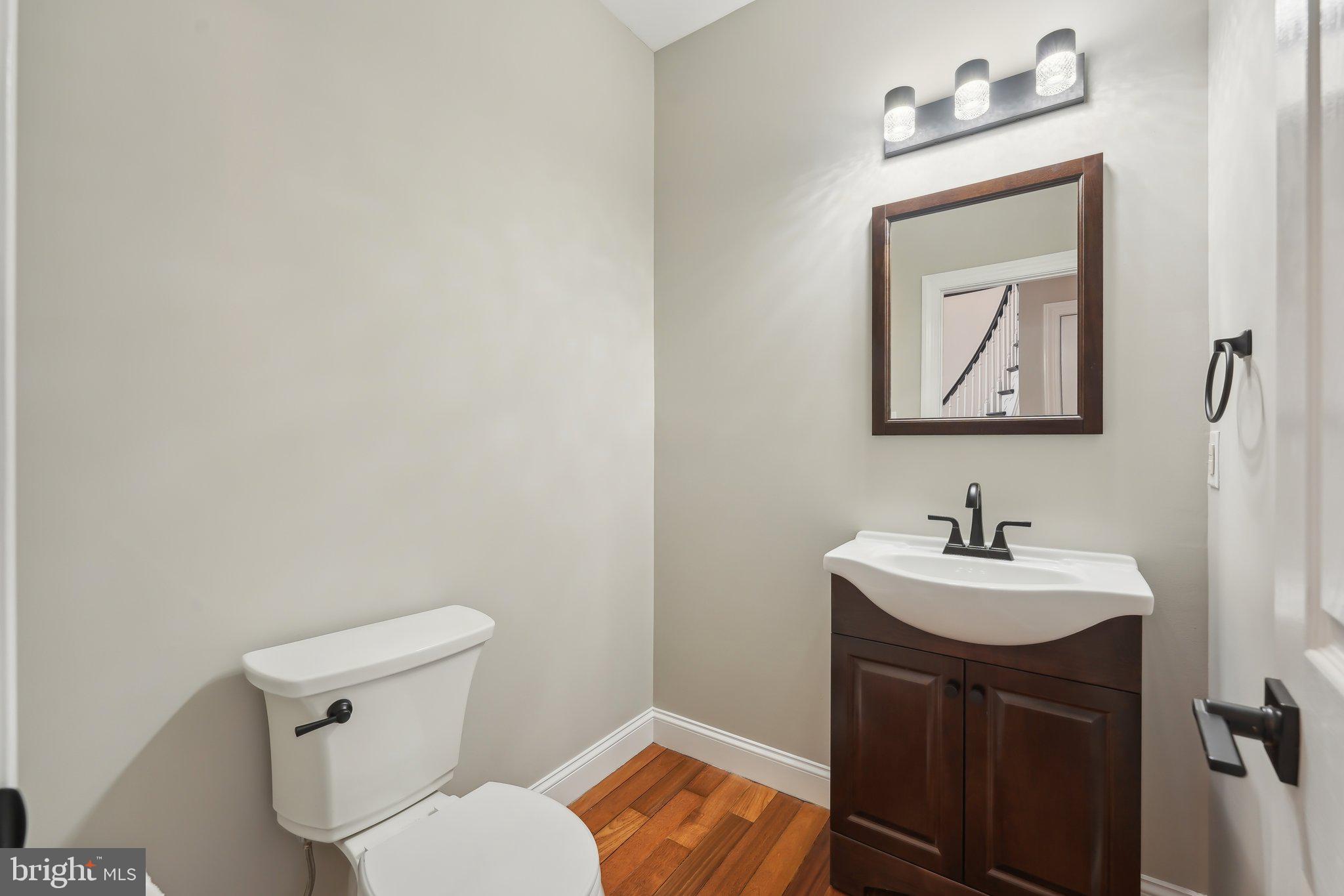 207 Summit Road Mount Laurel, NJ 08054 - Photo 46 of 57 a bathroom with a toilet sink and mirror