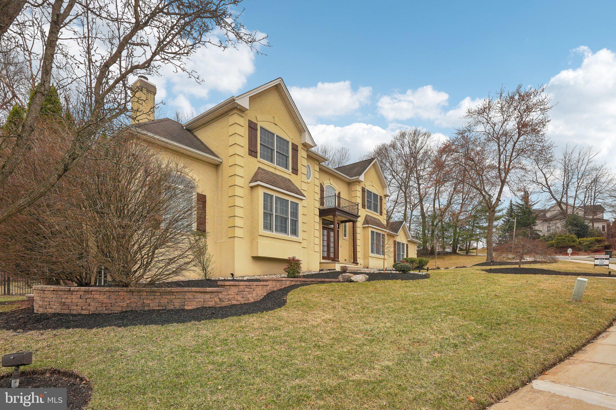 207 Summit Road Mount Laurel, NJ 08054 - Photo 5 of 57 a view of a white house with a yard covered with snow