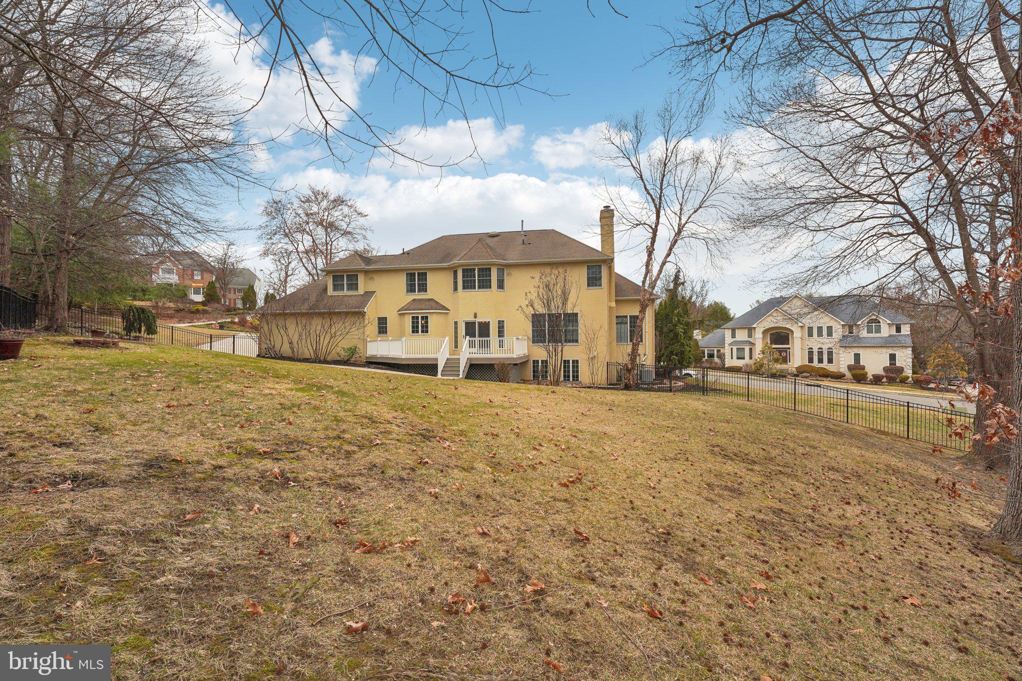 207 Summit Road Mount Laurel, NJ 08054 - Photo 52 of 57 a view of a large white house with a yard covered with snow and trees