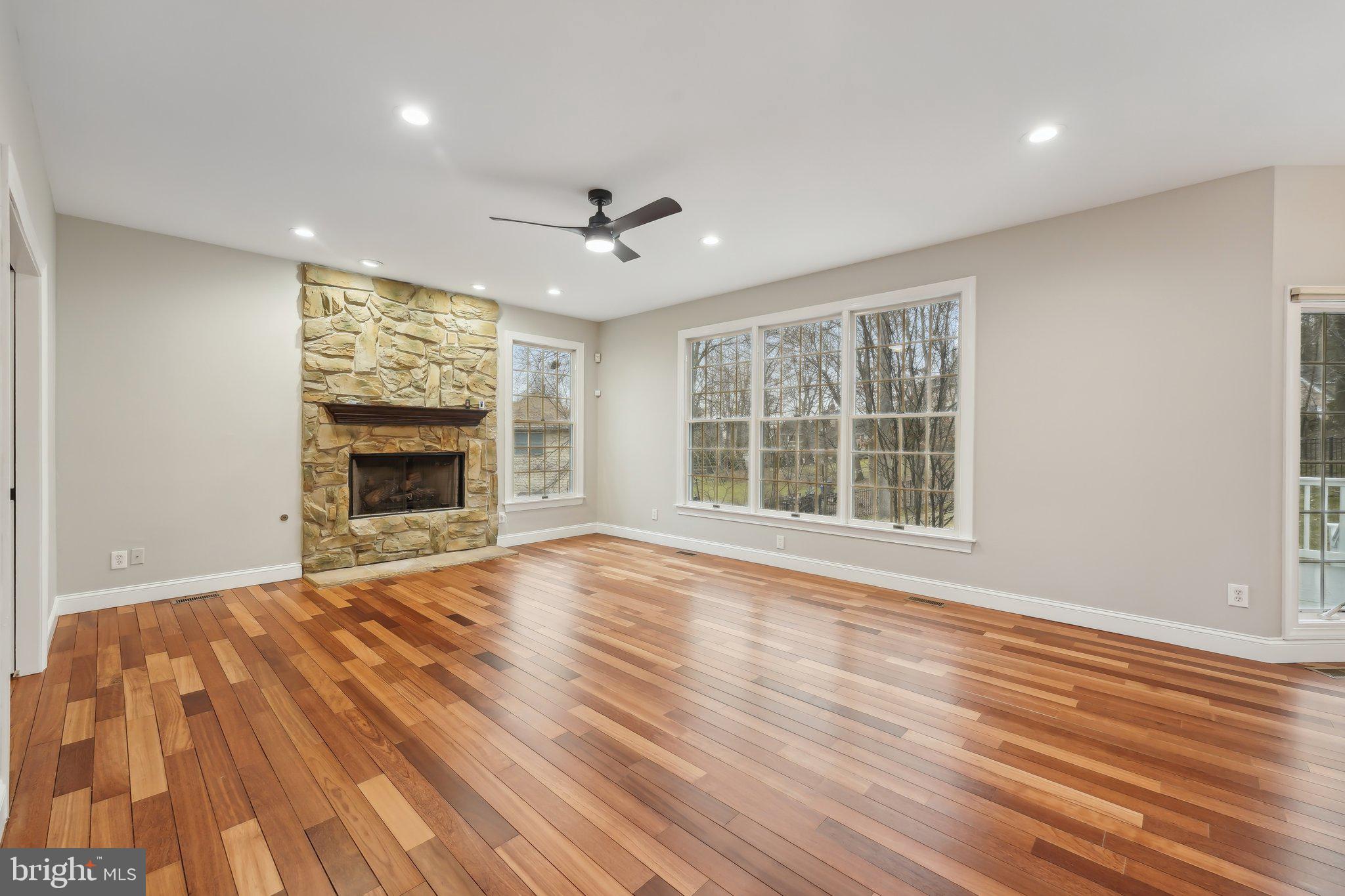 207 Summit Road Mount Laurel, NJ 08054 - Photo 9 of 57 a view of an empty room with wooden floor fireplace and a window