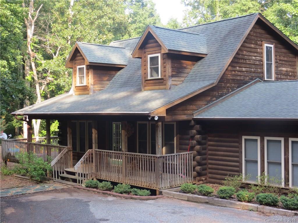 470 River Ridge Parkway Rutherfordton, NC 28139 - Photo 1 of 15 a view of brick house with large windows and a small yard
