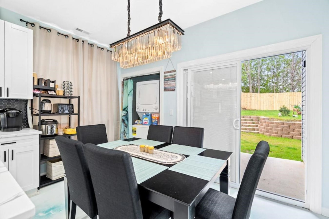 6901 Jeffreys Creek Lane Raleigh, NC 27616 - Photo 11 of 37 a view of a dining room with furniture window and outside view