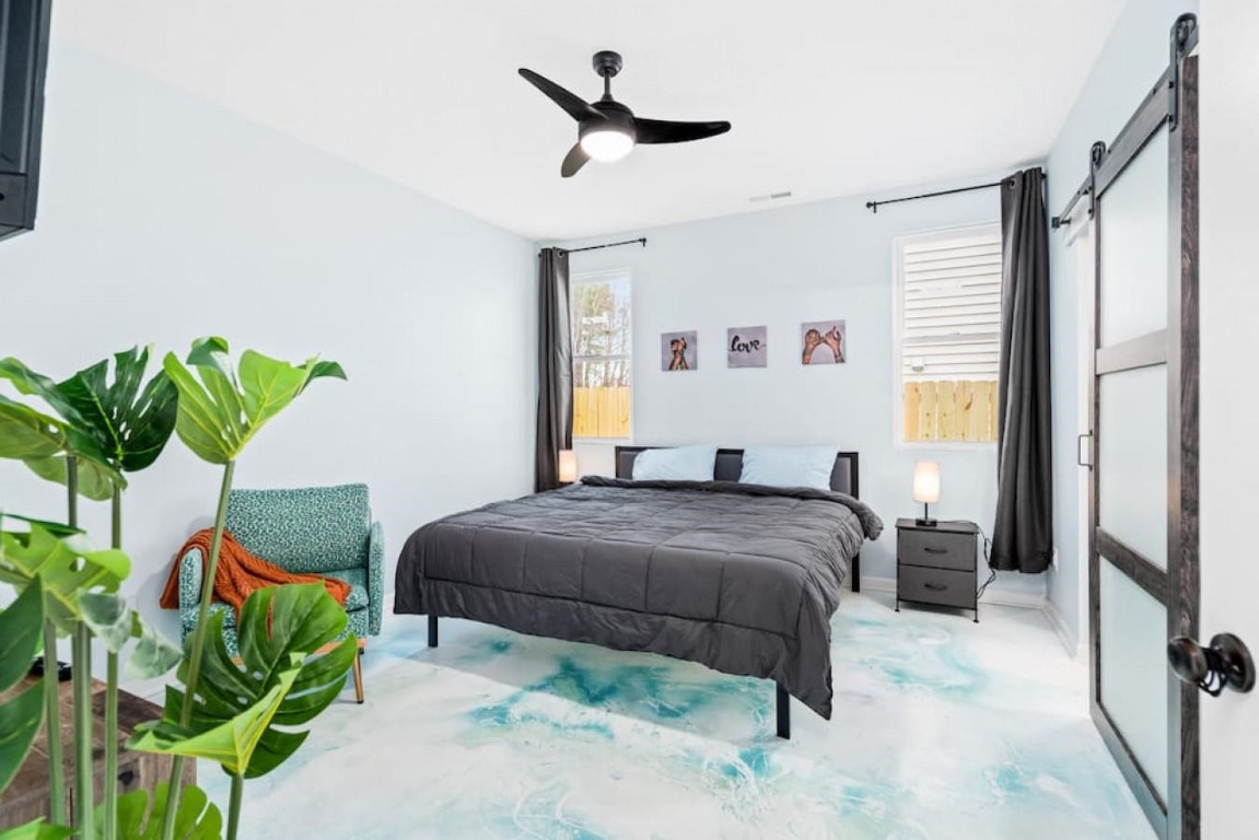 6901 Jeffreys Creek Lane Raleigh, NC 27616 - Photo 12 of 37 a bedroom with a bed potted plant and a window