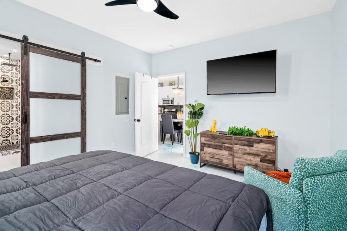 6901 Jeffreys Creek Lane Raleigh, NC 27616 - Photo 13 of 37 a bedroom with bed and flat screen tv