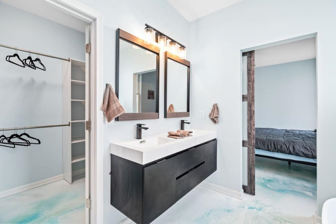 6901 Jeffreys Creek Lane Raleigh, NC 27616 - Photo 15 of 37 a en suite bathroom with a double vanity sink and a mirror