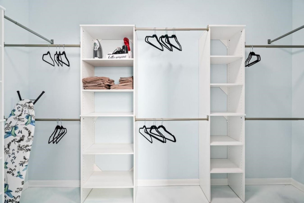 6901 Jeffreys Creek Lane Raleigh, NC 27616 - Photo 16 of 37 a view of walk in closet with clothes and shoes