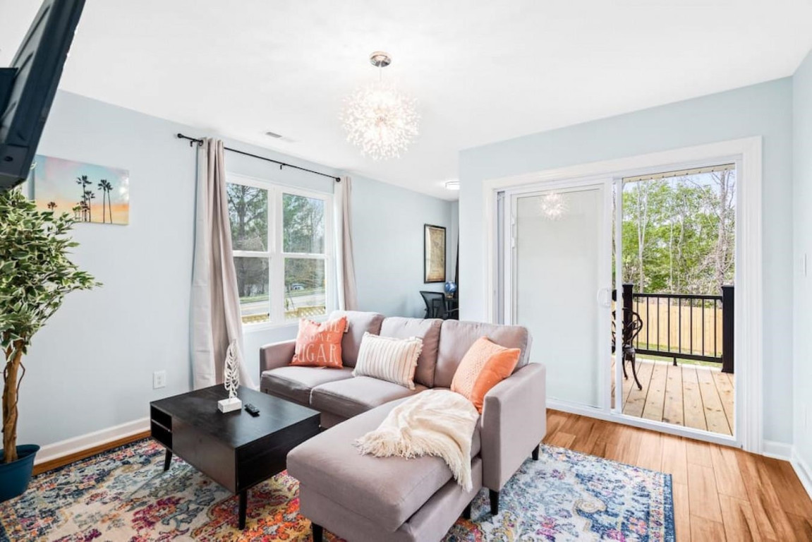 6901 Jeffreys Creek Lane Raleigh, NC 27616 - Photo 19 of 37 a living room with furniture and a window