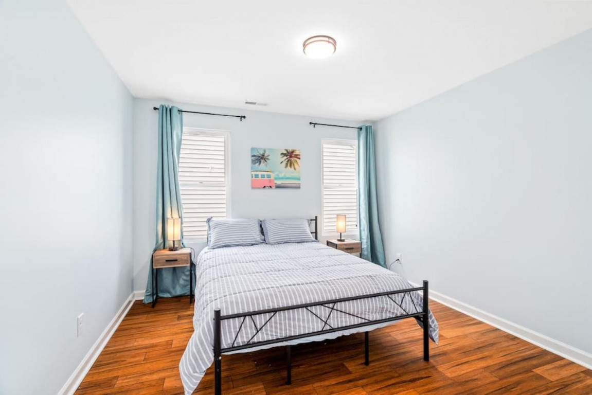 6901 Jeffreys Creek Lane Raleigh, NC 27616 - Photo 23 of 37 a bedroom with a bed and wooden floor