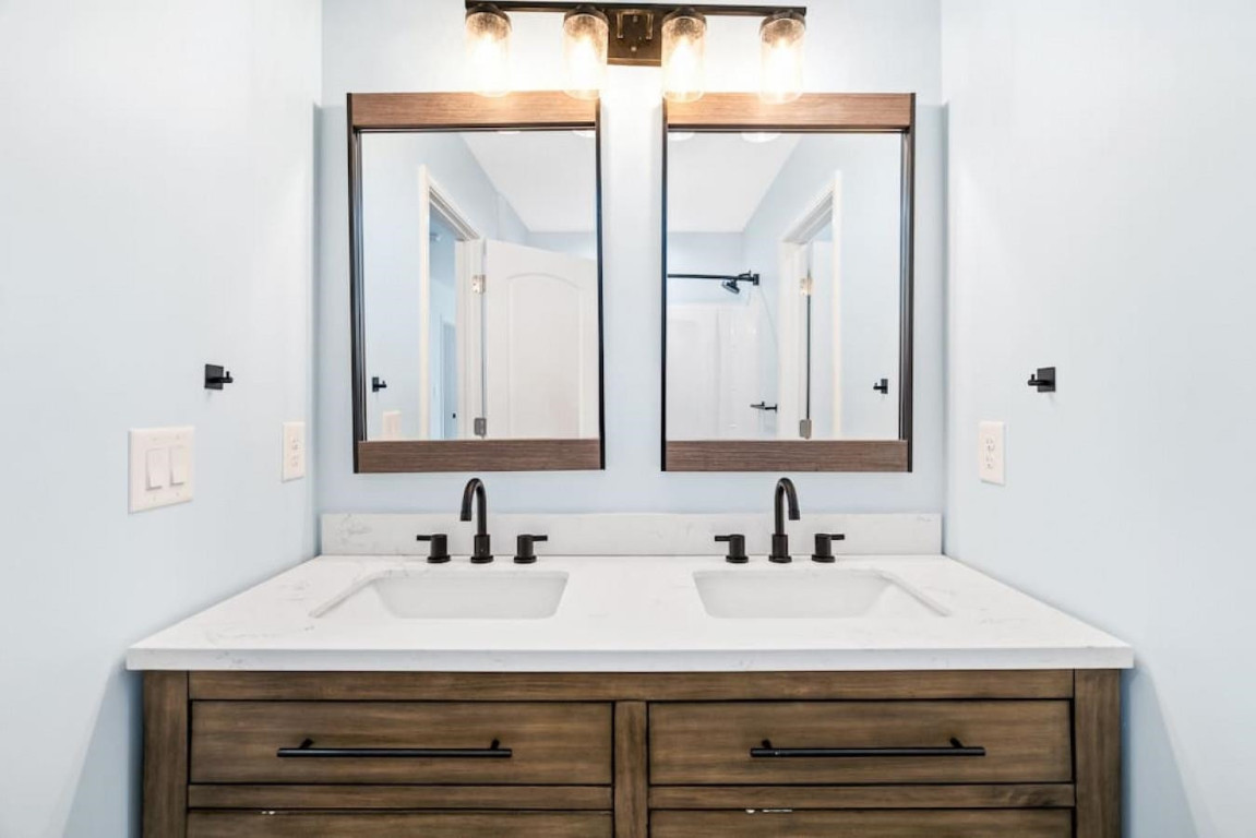 6901 Jeffreys Creek Lane Raleigh, NC 27616 - Photo 24 of 37 a bathroom with a sink and a mirror