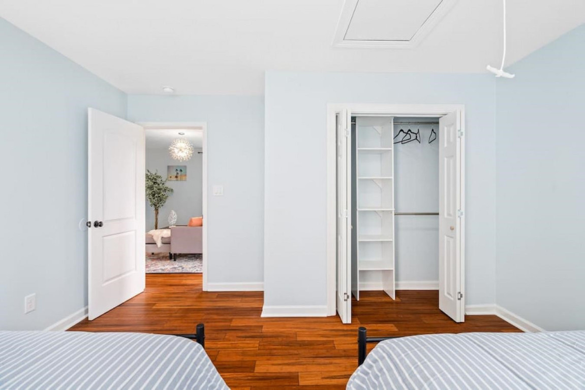 6901 Jeffreys Creek Lane Raleigh, NC 27616 - Photo 25 of 37 a bedroom with a bed and wooden floor