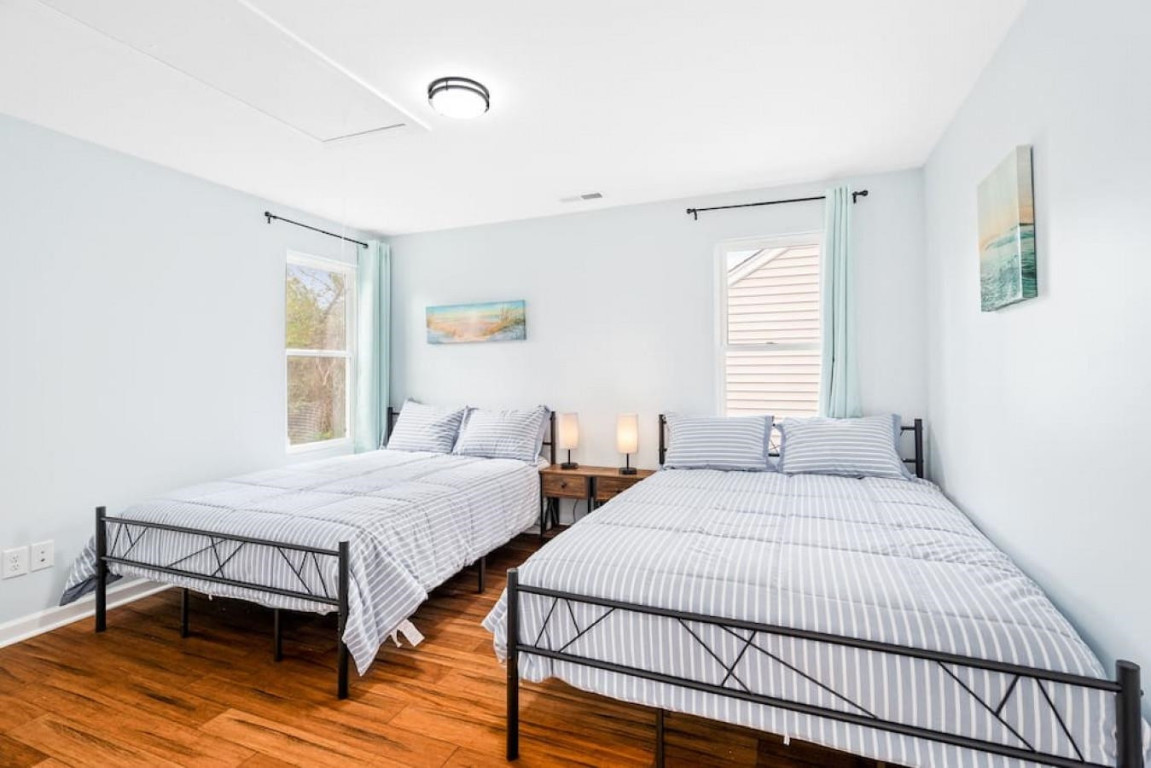6901 Jeffreys Creek Lane Raleigh, NC 27616 - Photo 26 of 37 a bedroom with two beds and wooden floor