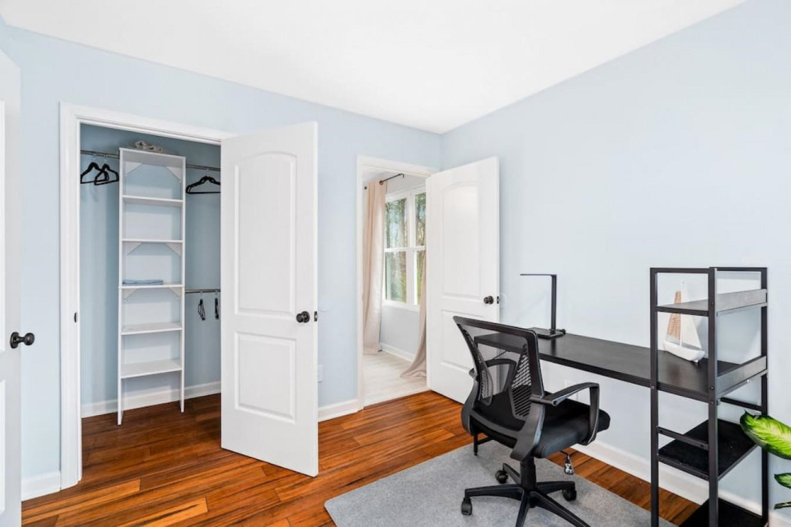 6901 Jeffreys Creek Lane Raleigh, NC 27616 - Photo 28 of 37 a view of a workspace with wooden floor and a window
