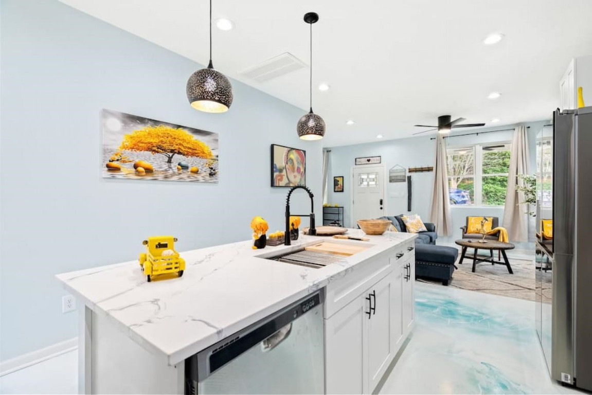 6901 Jeffreys Creek Lane Raleigh, NC 27616 - Photo 30 of 37 a view of center island with furniture and floor