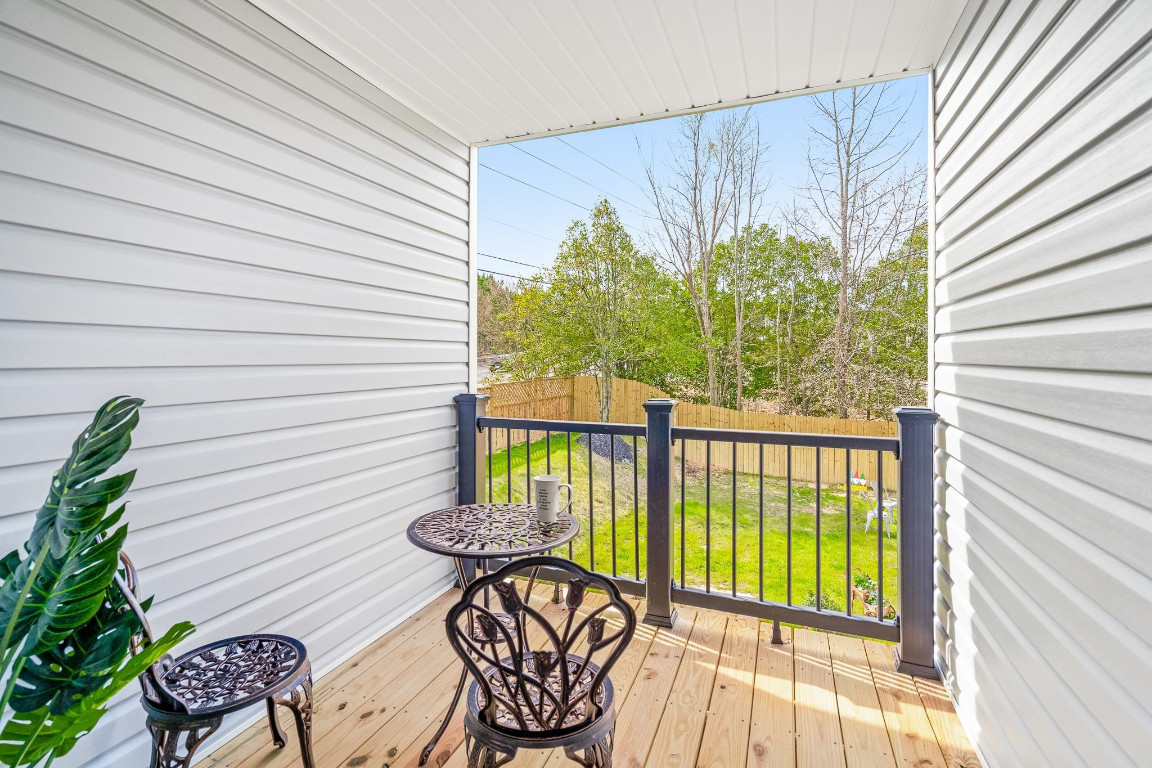 6901 Jeffreys Creek Lane Raleigh, NC 27616 - Photo 31 of 37 a view of a chairs and table in patio