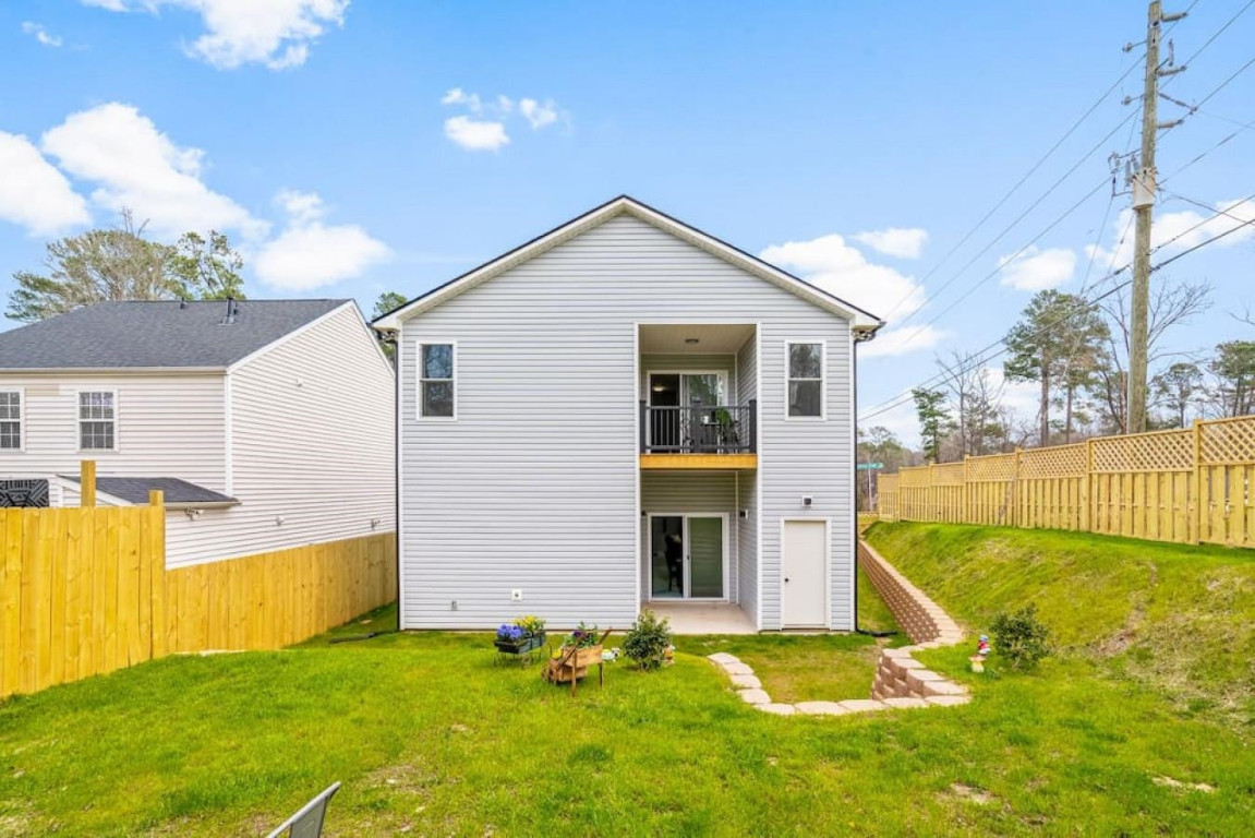6901 Jeffreys Creek Lane Raleigh, NC 27616 - Photo 35 of 37 a view of a house with a yard and a large tree
