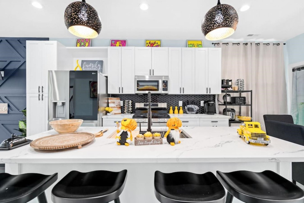 6901 Jeffreys Creek Lane Raleigh, NC 27616 - Photo 8 of 37 a kitchen with a table and chairs in it