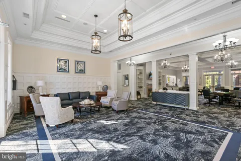 a kitchen with stainless steel appliances granite countertop a refrigerator stove and sink