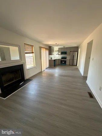 a view of a livingroom with furniture and a fireplace
