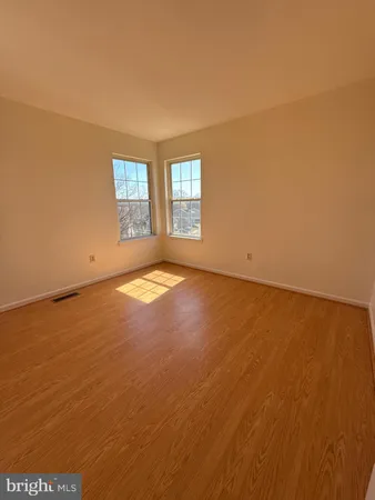 an empty room with a empty space and a window