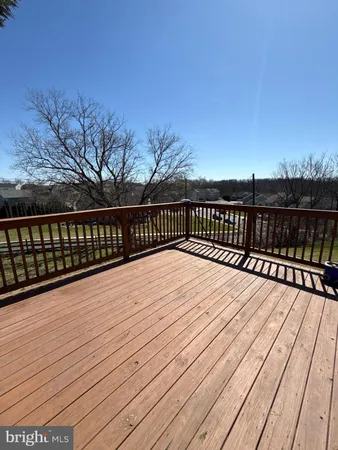 a balcony with wooden floor
