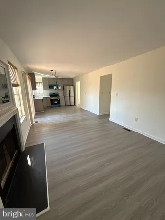a view of a livingroom with wooden floor