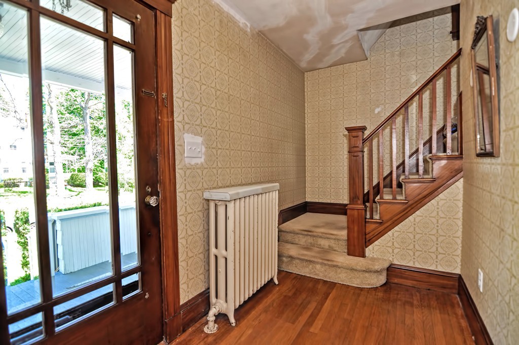 175 Union Street Walpole, MA 02032 - Photo 11 of 29 a view of front door with wooden floor and stairs