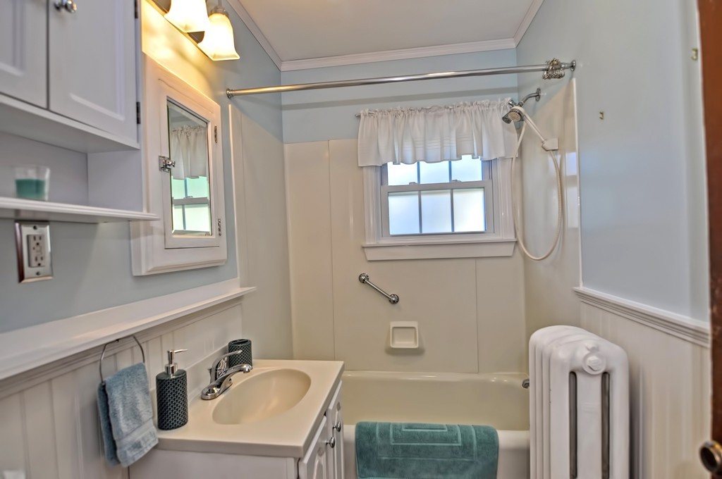 175 Union Street Walpole, MA 02032 - Photo 12 of 29 a bathroom with a sink mirror and a bathtub