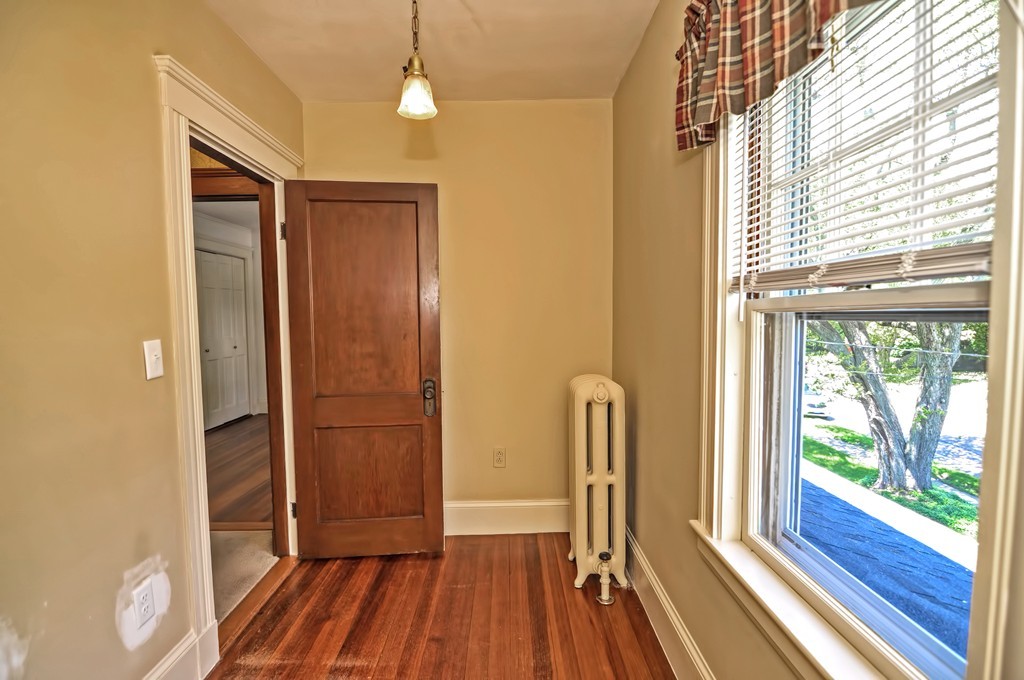 175 Union Street Walpole, MA 02032 - Photo 15 of 29 a view of hallway with a large window and wooden floor