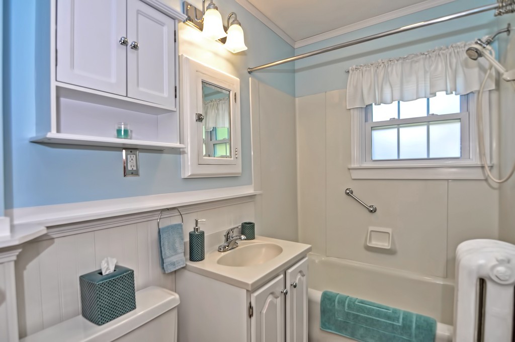 175 Union Street Walpole, MA 02032 - Photo 16 of 29 a bathroom with a sink a toilet and vanity