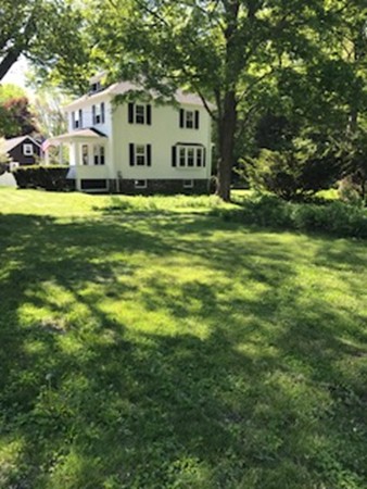 175 Union Street Walpole, MA 02032 - Photo 29 of 29 a front view of house with yard and trees