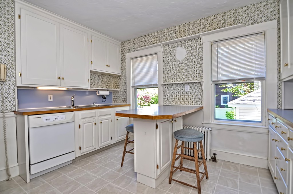 175 Union Street Walpole, MA 02032 - Photo 4 of 29 a kitchen with granite countertop a sink cabinets and window