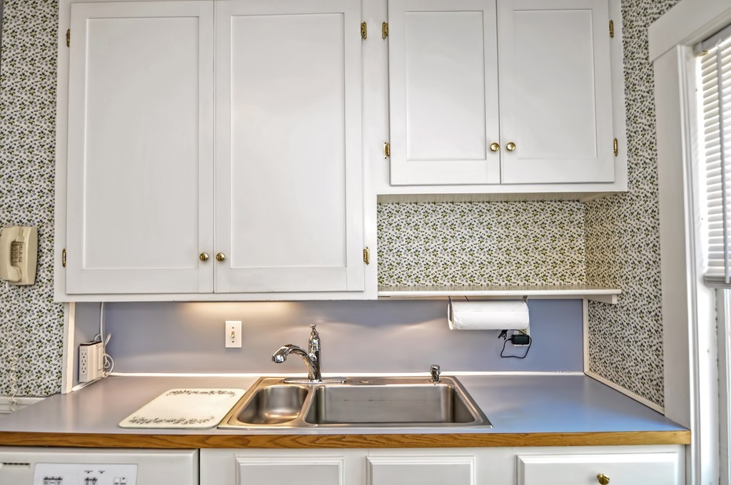 175 Union Street Walpole, MA 02032 - Photo 5 of 29 a view of kitchen with granite countertop white cabinets and a sink