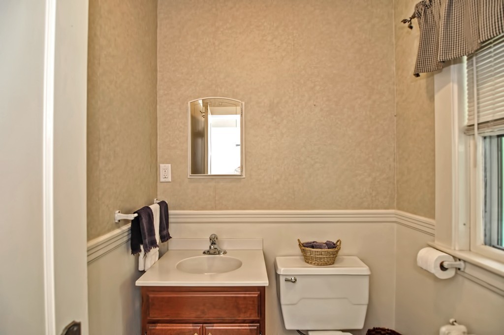 175 Union Street Walpole, MA 02032 - Photo 7 of 29 a bathroom with a sink and a mirror